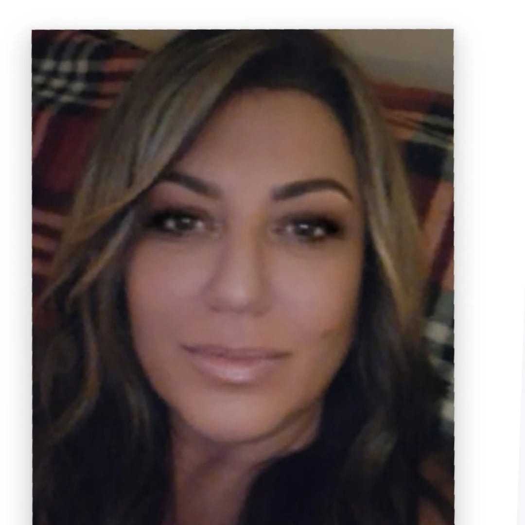 Portrait of Linda, a professional stylist at Invidia Salon and Spa, showcasing their expertise and style.